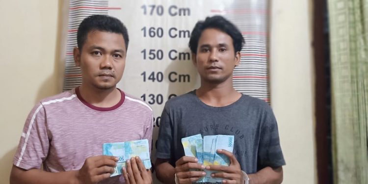 Tandai Wajahnya, Dua Pria Ini Cetak dan Edarkan Uang Palsu Pecahan Rp50 Ribu