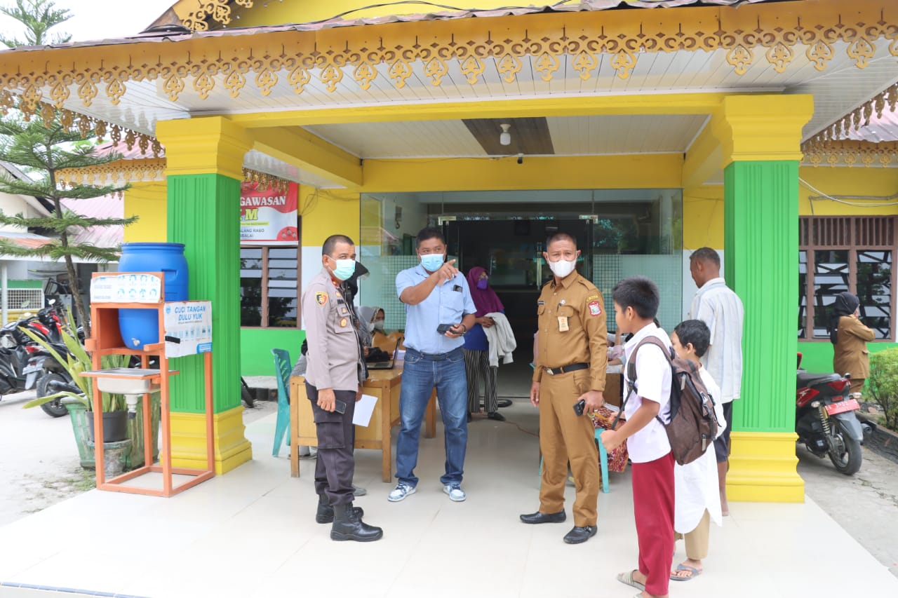 Polres Tanjungbalai Kawal Penyaluran BLT dan Vaksinasi Bagi Masyarakat di Kota Tanjungbalai