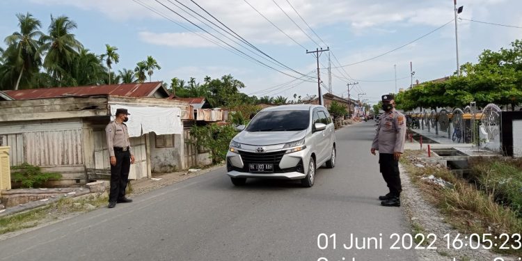 Personel Polsek Sei Kepayang Atur Arus Lalulintas 